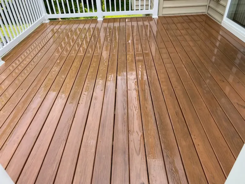 Freshly cleaned brown deck with white railings in Branford