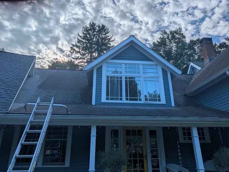 Roof cleaning project at a gray Branford home