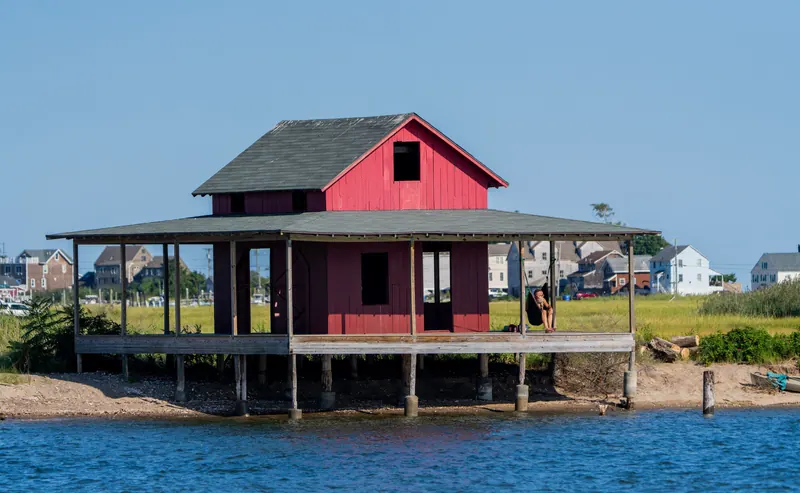 Red waterfront building beside the water in Guilford, Connecticut