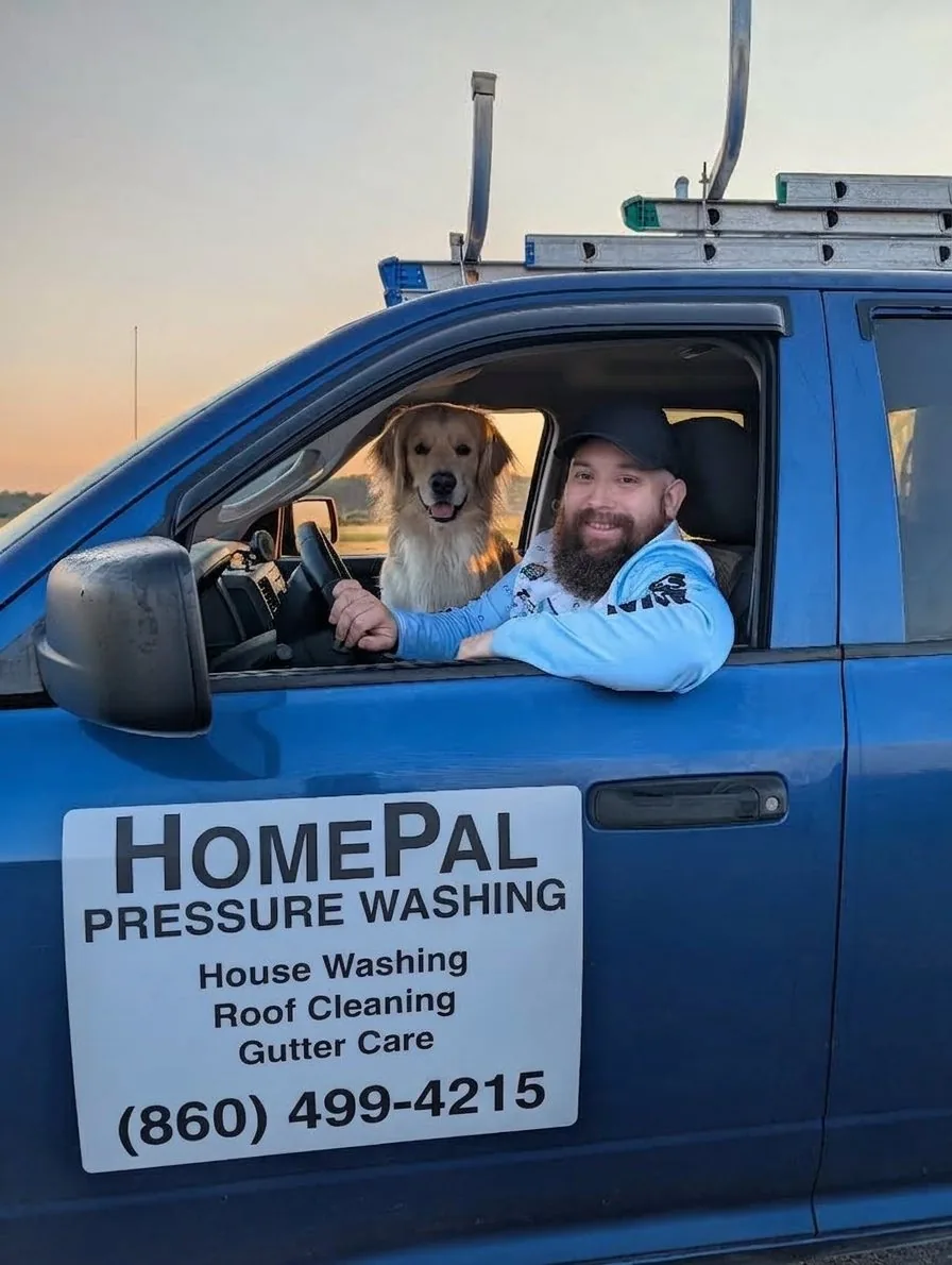 Greg and his dog in the HomePal Pressure Washing truck serving Guilford, CT