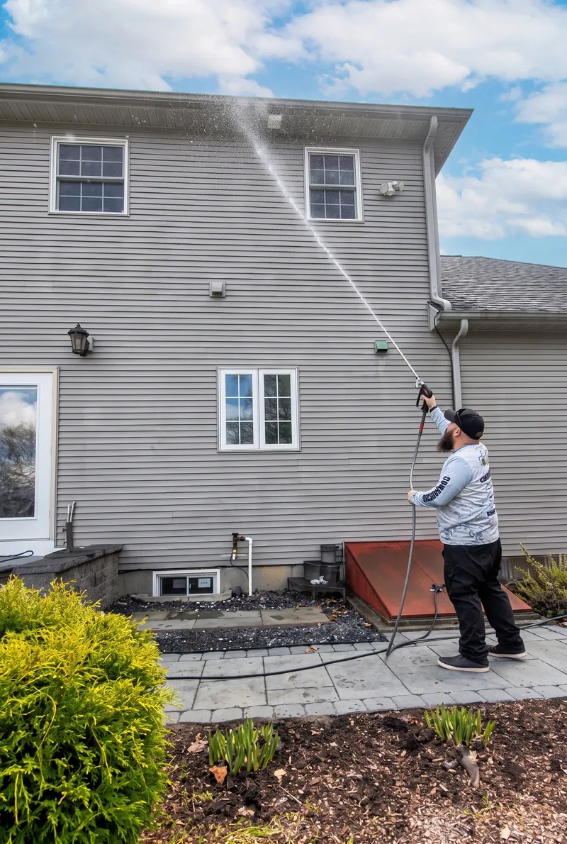 Greg soft washing house siding in Guilford, Connecticut