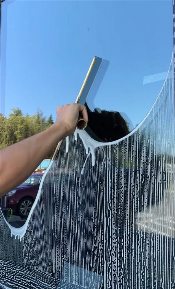 Window cleaning with a squeegee by HomePal, serving the Connecticut Shoreline